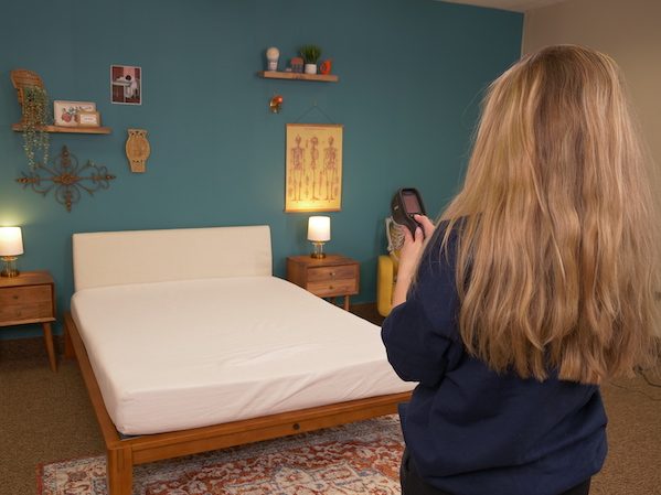 Julia Forbes testing temperature dissipation on a mattress